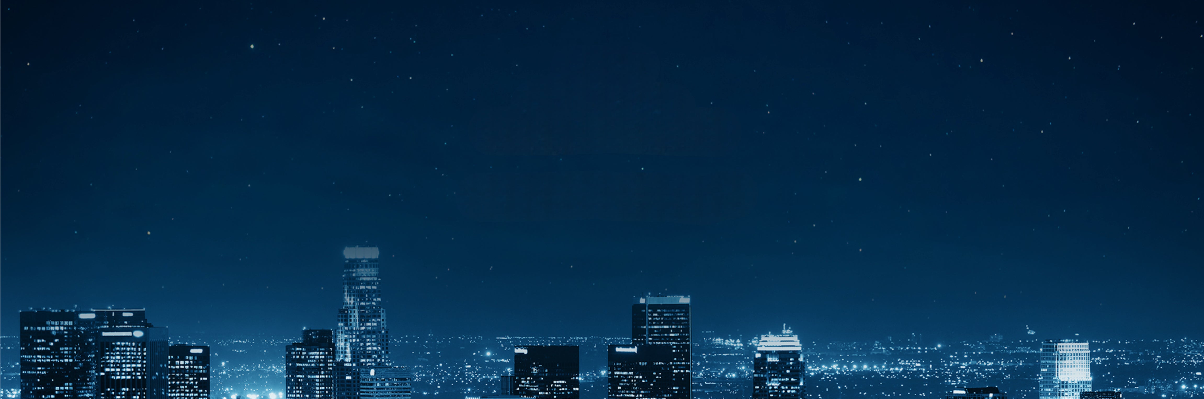 Cityscape at night with vibrant lights Night view of a city skyline with illuminated buildings