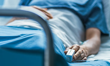 Patient completing hospital admission paperwork